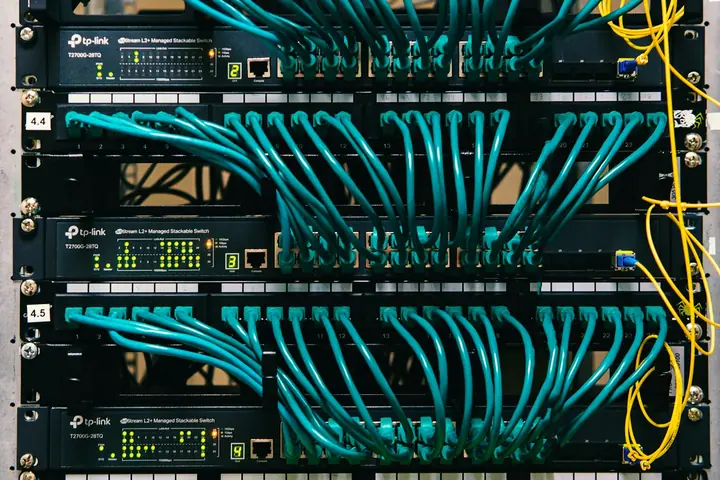 Structured cabling terminated into network switches in a school telecom room