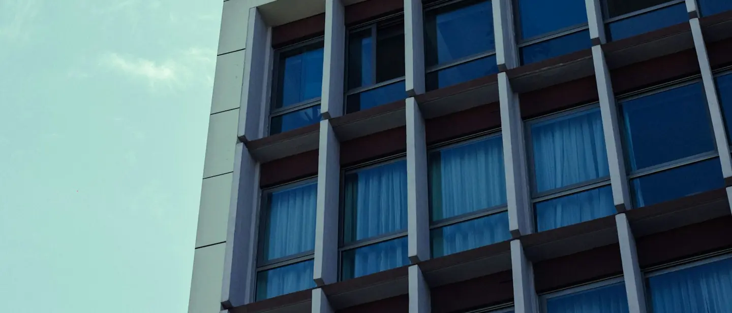 Modern commercial building facade with regular vertical fins